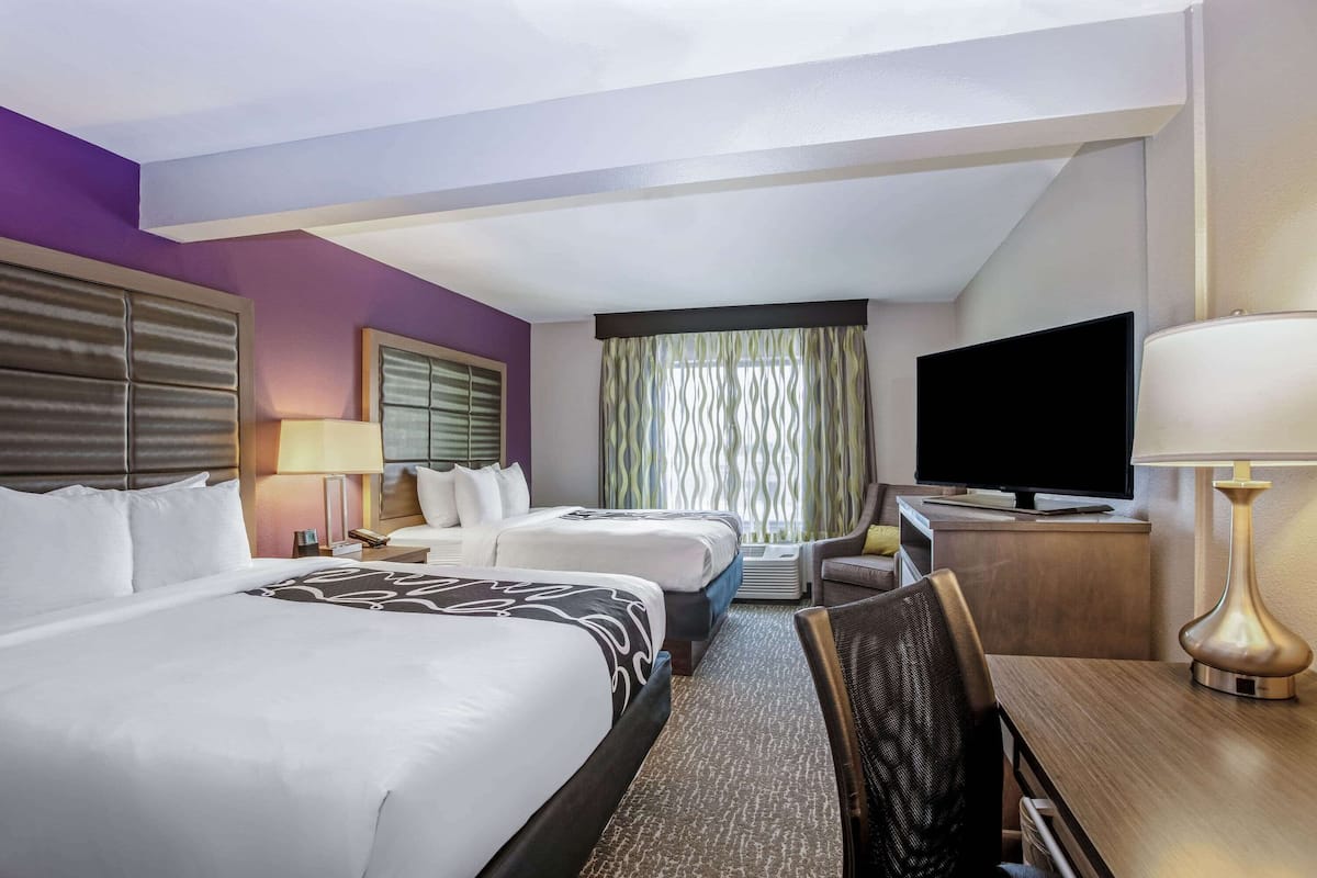 Deluxe Room, 2 Queen Beds, Non Smoking | Premium bedding, desk, iron/ironing board, free cribs/infant beds