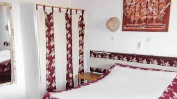 Desk, blackout drapes, bed sheets