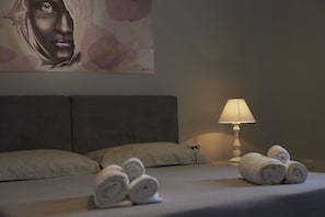 Panoramic Quadruple Room, Ocean View | Frette Italian sheets, premium bedding, down comforters