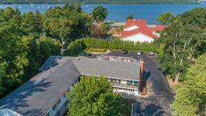 A building with a red roof, surrounded by trees and a parking lot. - Wilder Inn (Ephraim)