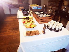 Indulge in a spread of fresh fruits, baked goods, and refreshing beverages at our buffet.