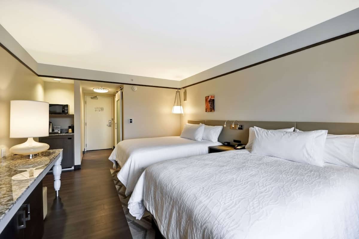 Desk, laptop workspace, blackout drapes, iron/ironing board