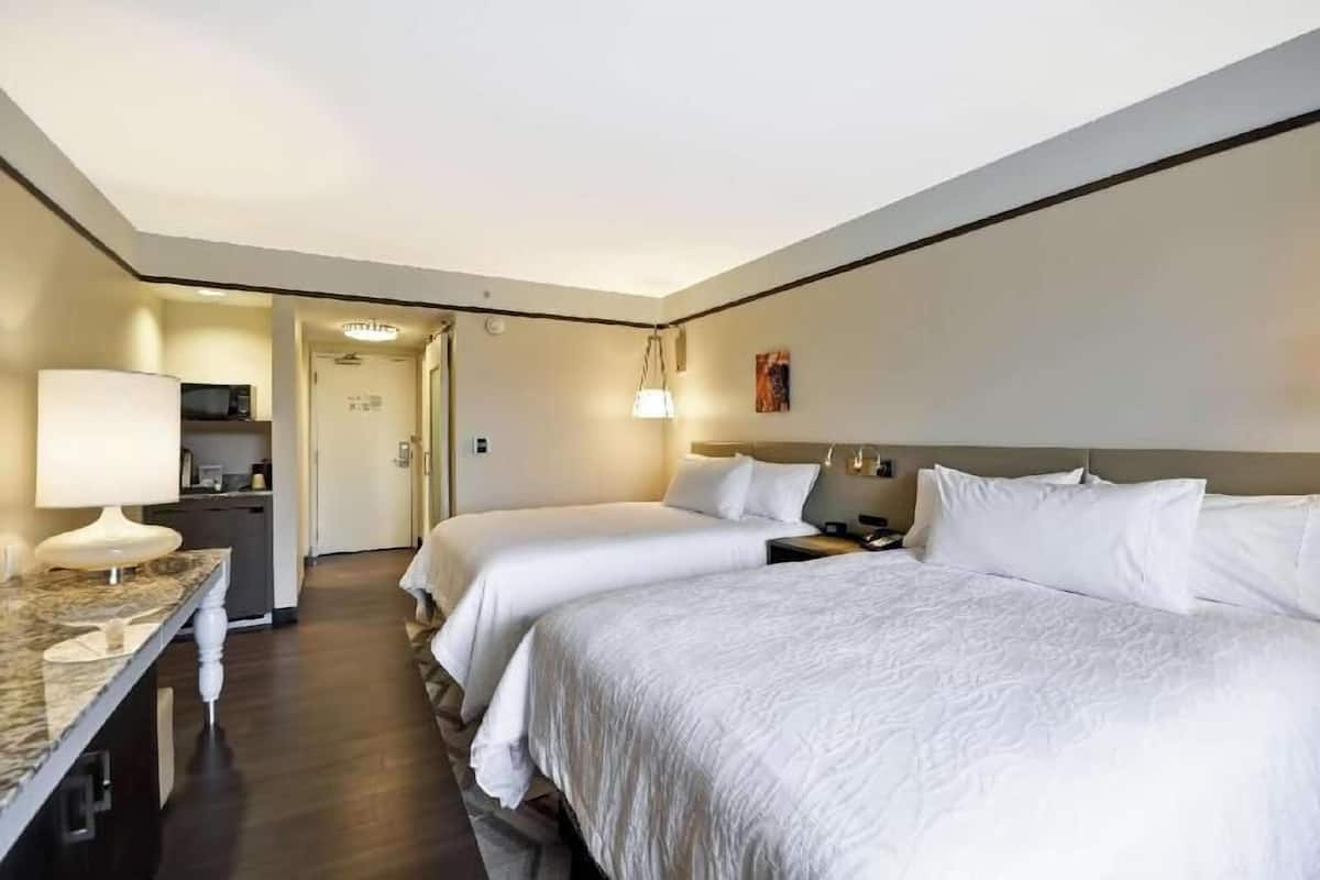 Desk, laptop workspace, blackout drapes, iron/ironing board