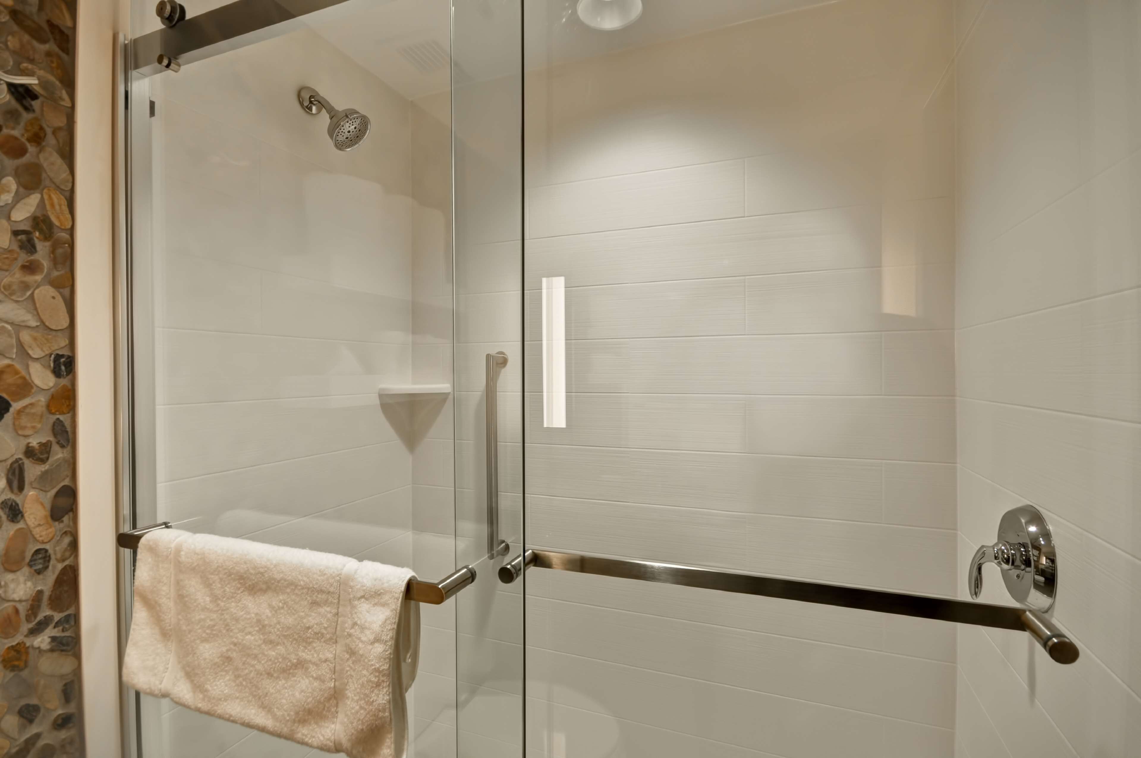 designer toiletries, hair dryer, towels, toilet paper