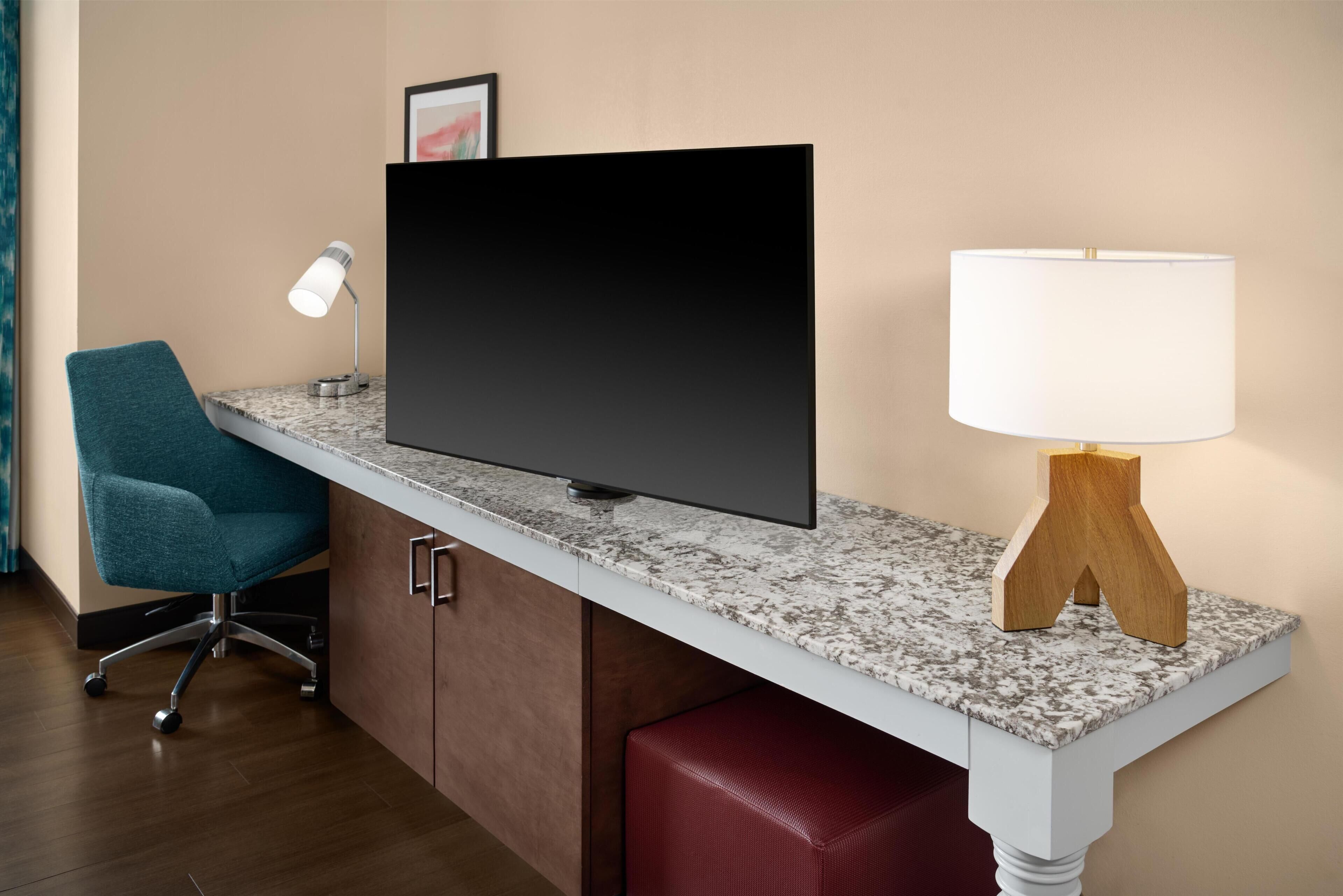 Desk, laptop workspace, blackout drapes, iron/ironing board