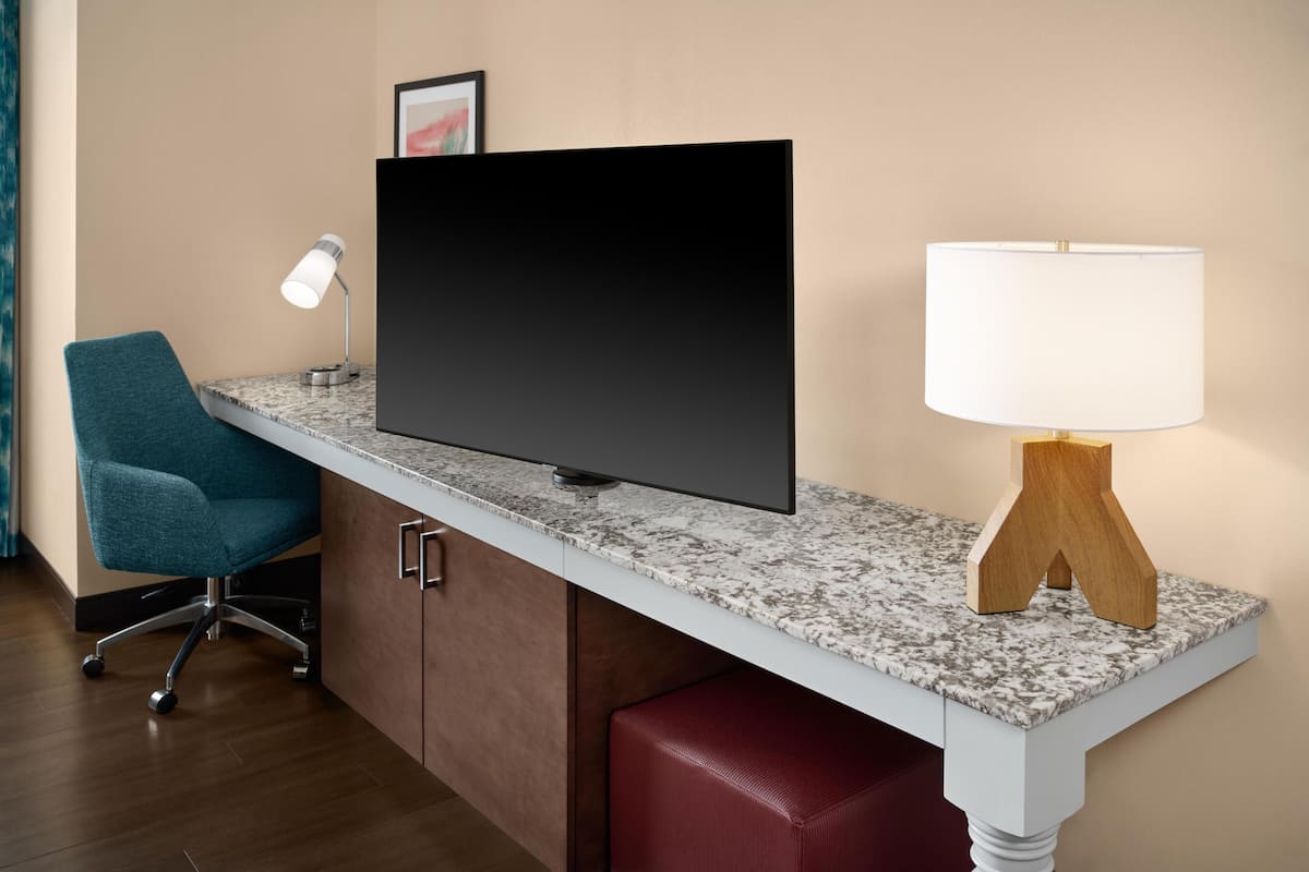 Desk, laptop workspace, blackout drapes, iron/ironing board