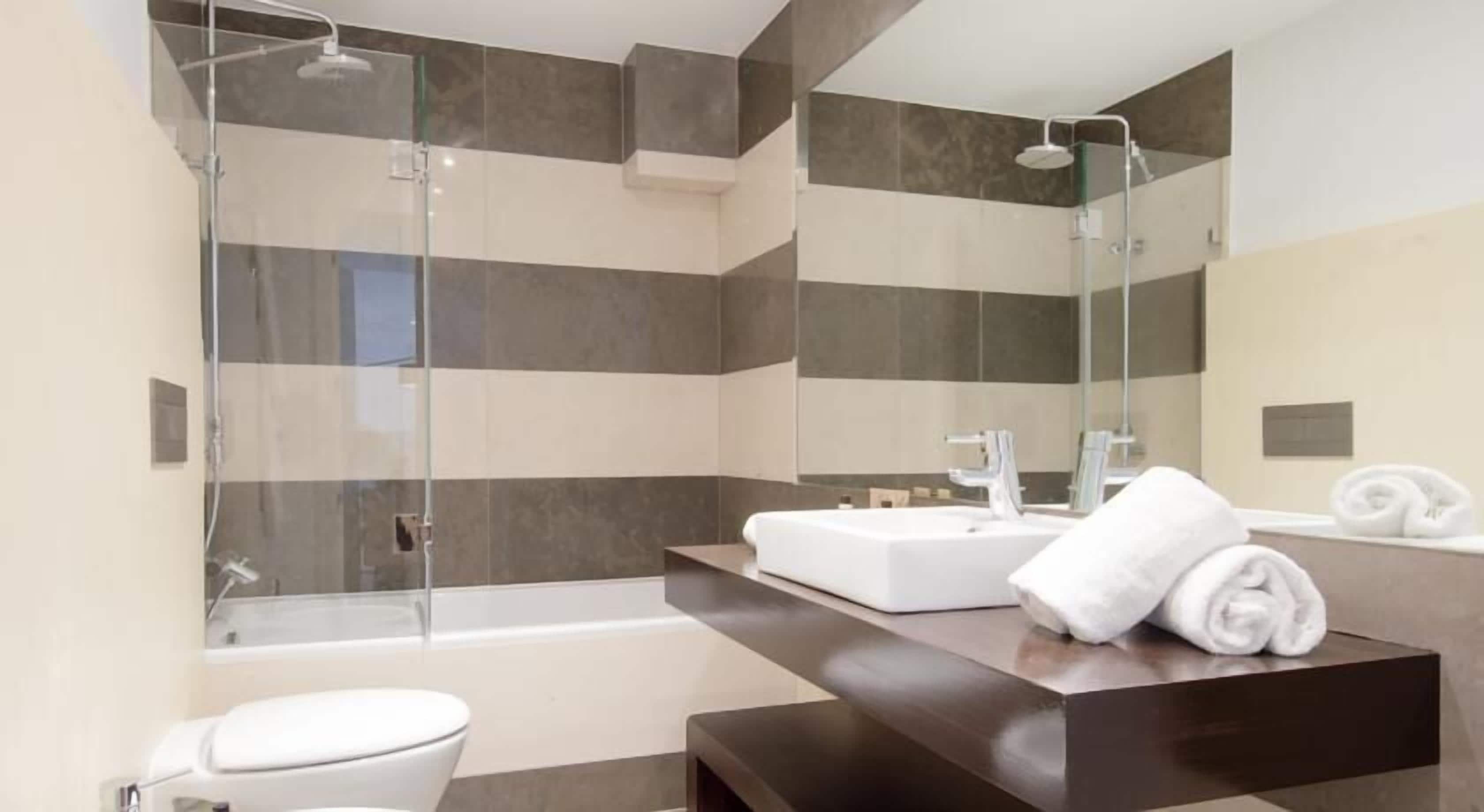 bathtub, free toiletries, hair dryer, bathrobes