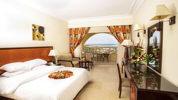Premium Room, Partial Sea View | Down comforters, minibar, in-room safe, desk