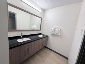 Exclusive Triple Room, 3 Bedrooms | Bathroom | Shower, free toiletries, towels, soap