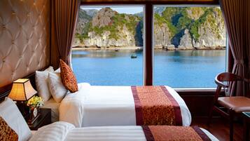 Deluxe Triple Room, Sea View | Pillowtop beds, blackout drapes, bed sheets