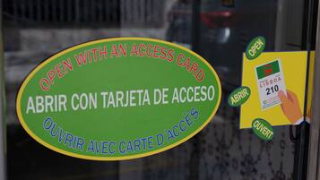 A sign indicating the use of an access card to enter.