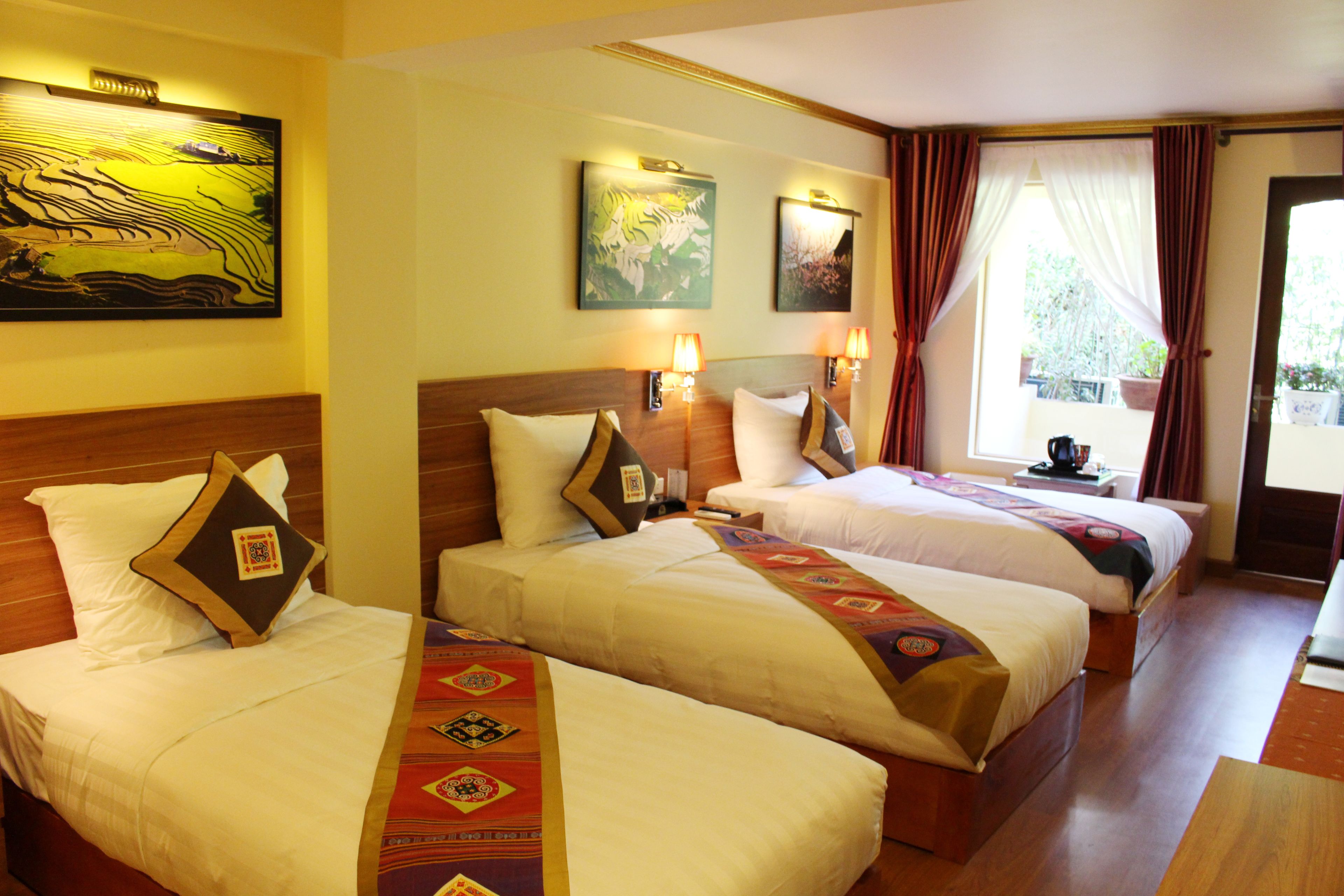 deluxe triple room | minibar, in-room safe, desk, blackout curtains