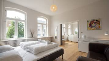 Family Apartment, Multiple Beds | 2 bedrooms, blackout drapes, free WiFi, bed sheets