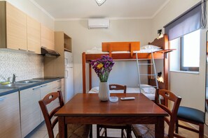 Family Apartment, 1 Bedroom | 1 bedroom, blackout drapes, cribs (free), WiFi (free)