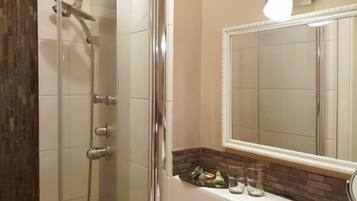 Shower, rainfall showerhead, hair dryer, towels