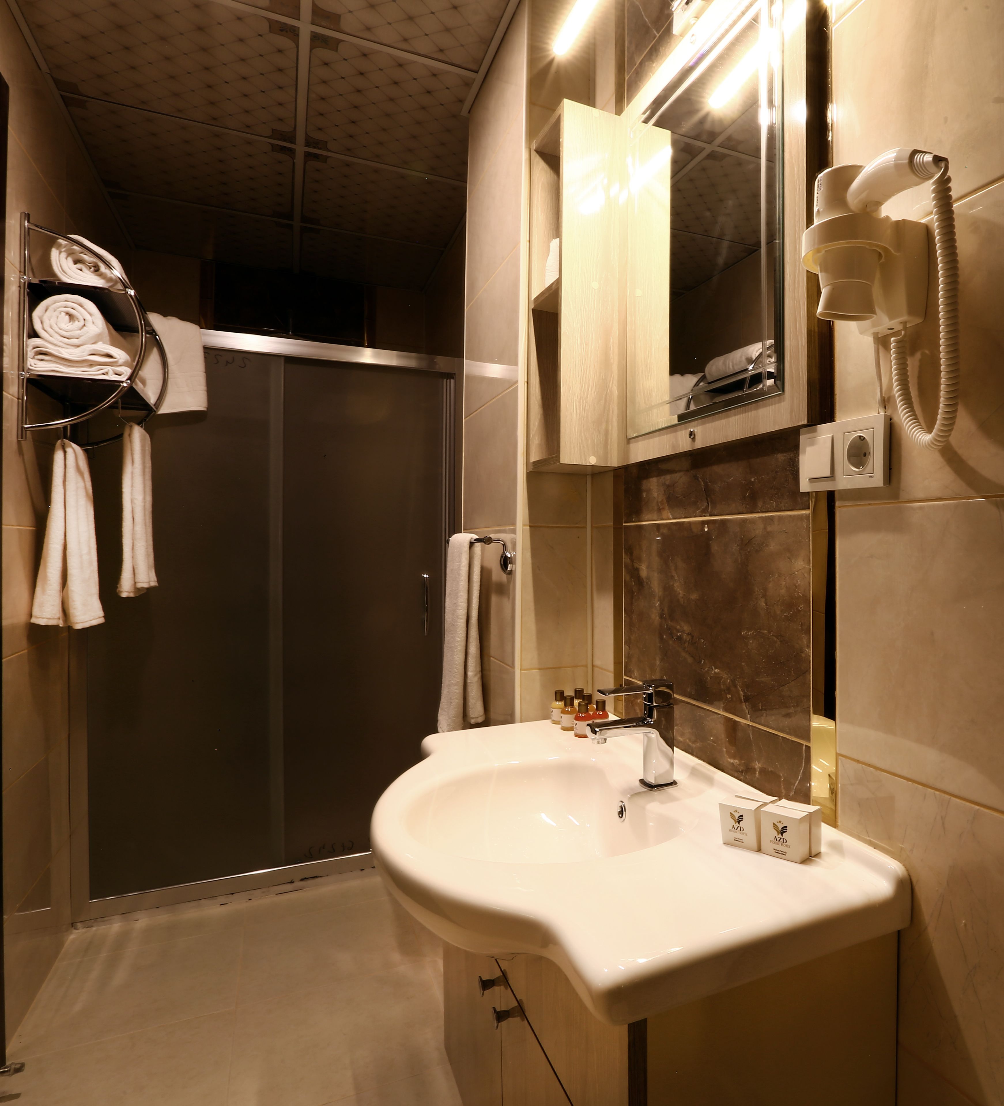 shower, free toiletries, hair dryer, towels