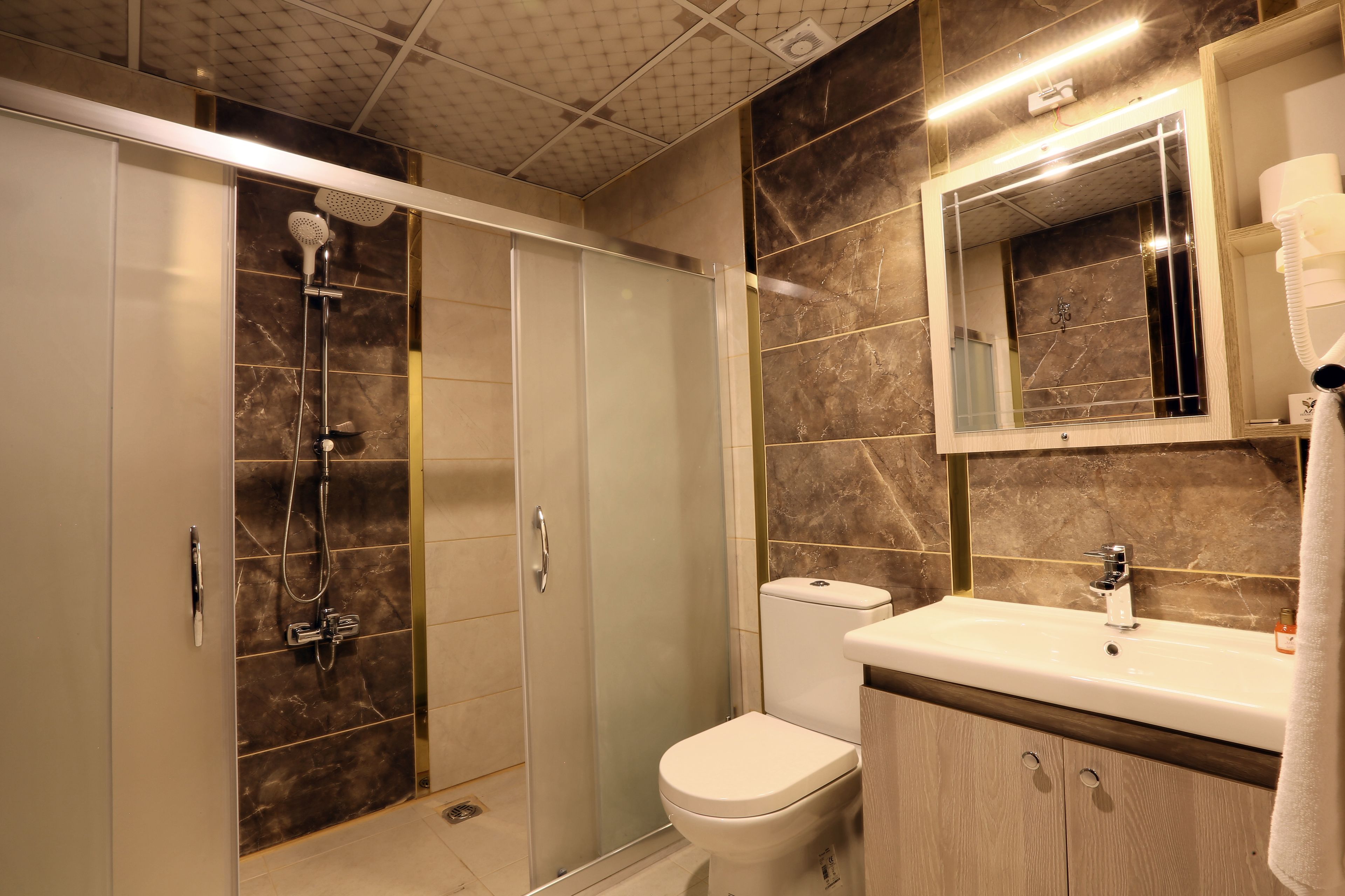 shower, free toiletries, hair dryer, towels