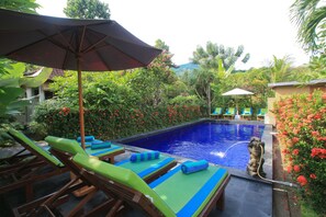 Outdoor pool, pool umbrellas, pool loungers