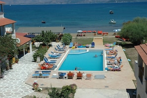 Outdoor pool, pool umbrellas, pool loungers
