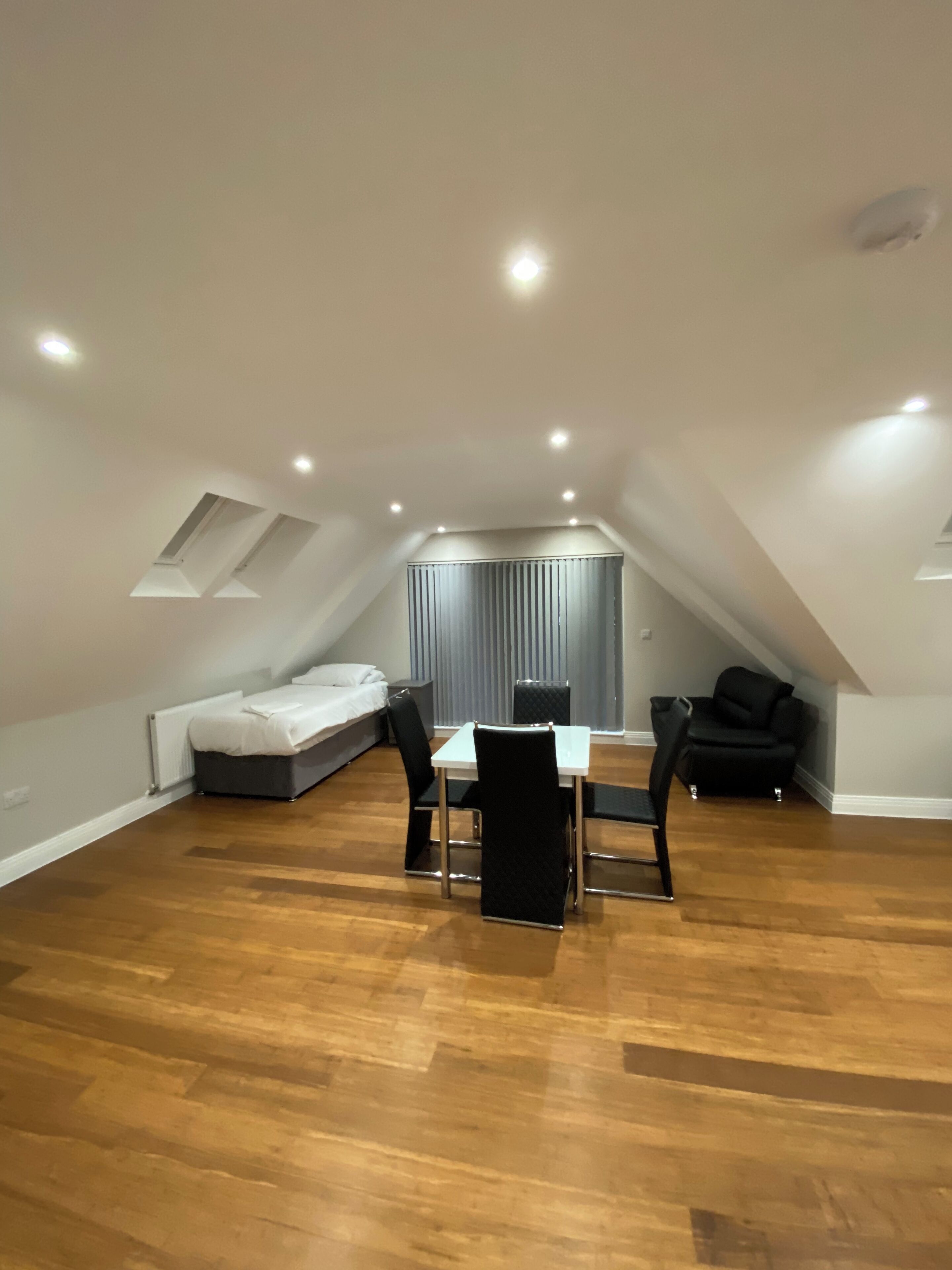 Premium bedding, desk, laptop workspace, soundproofing