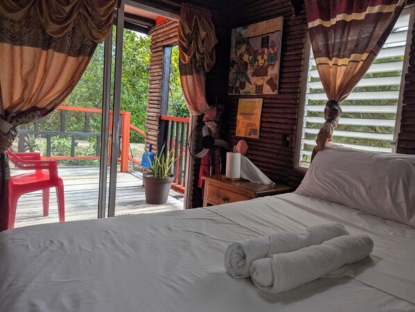 Traditional Cabin, 1 Bedroom, Garden View, Beachfront | 1 bedroom, pillowtop beds, desk, blackout drapes - Palmento Grove Eco Cultural & Fishing Lodge (Hopkins)