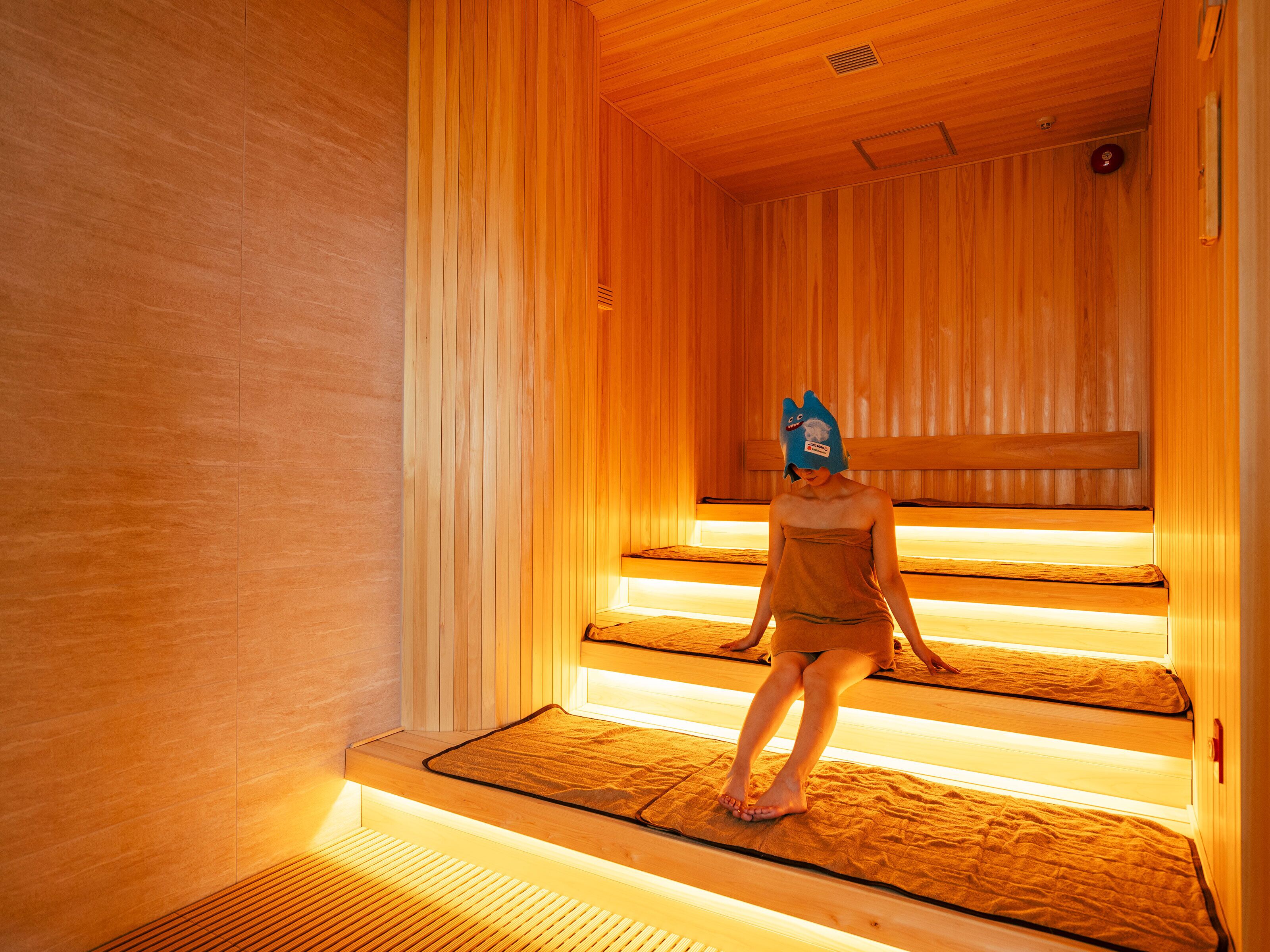 A sauna with wooden walls and benches.