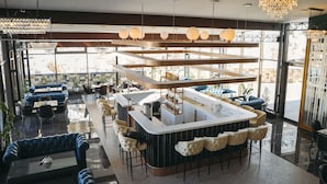 A modern bar area with seating and a counter. - Jannat Resort (Koy-Tash)