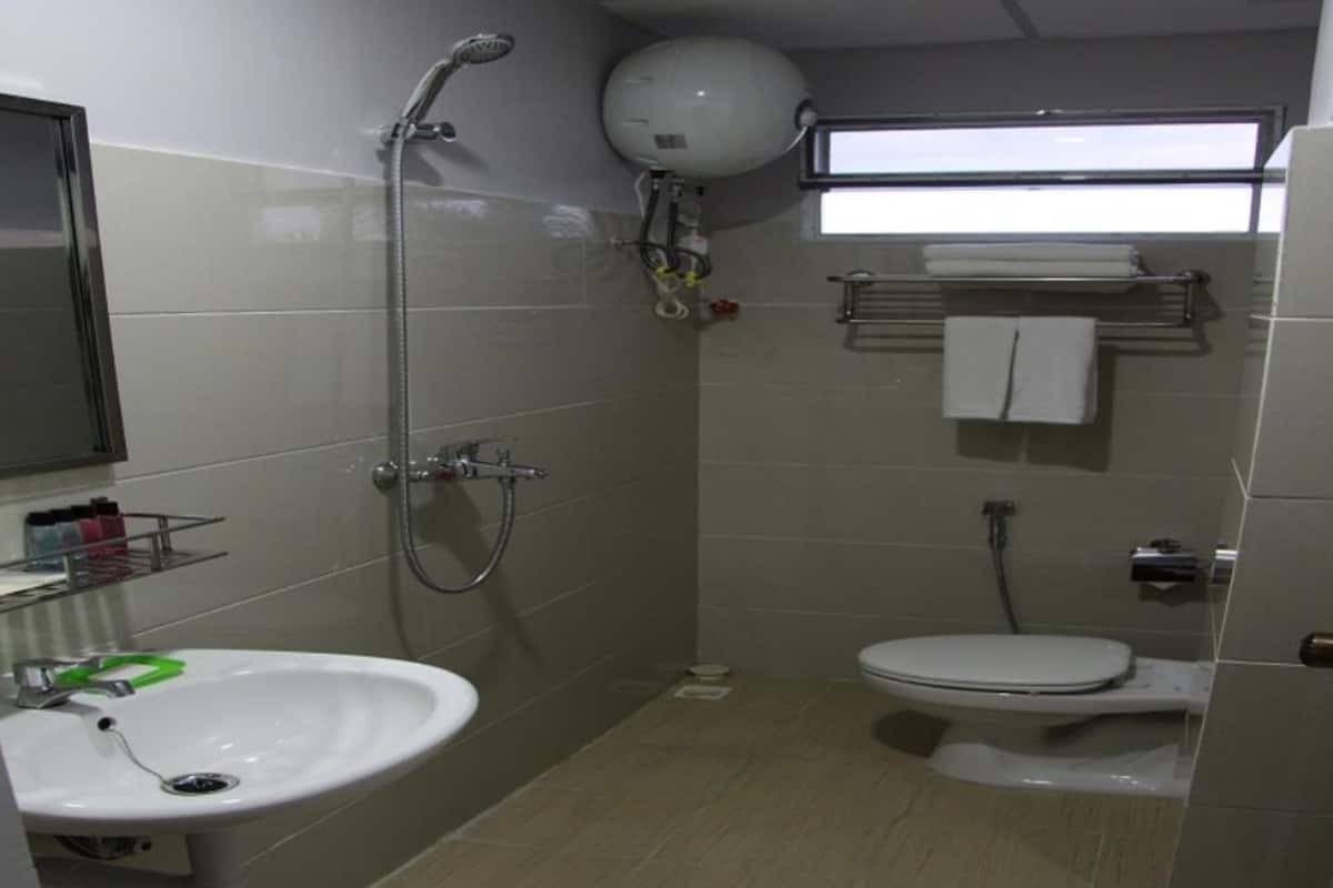 Shower, free toiletries, hair dryer, slippers