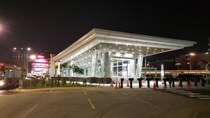A modern building with a large entrance and a covered area. - Hotel Mezzo (Kuala Lumpur)