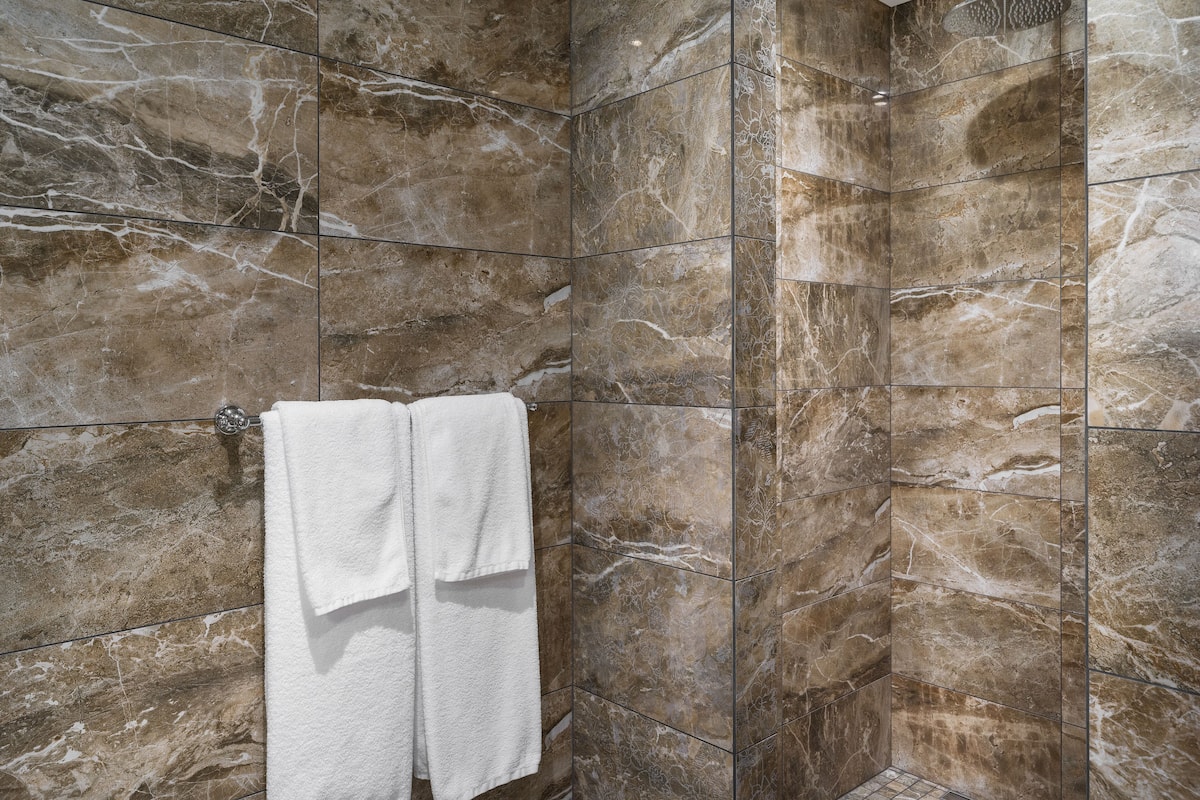 junior suite | bathroom | shower, rainfall showerhead, free toiletries, hair dryer