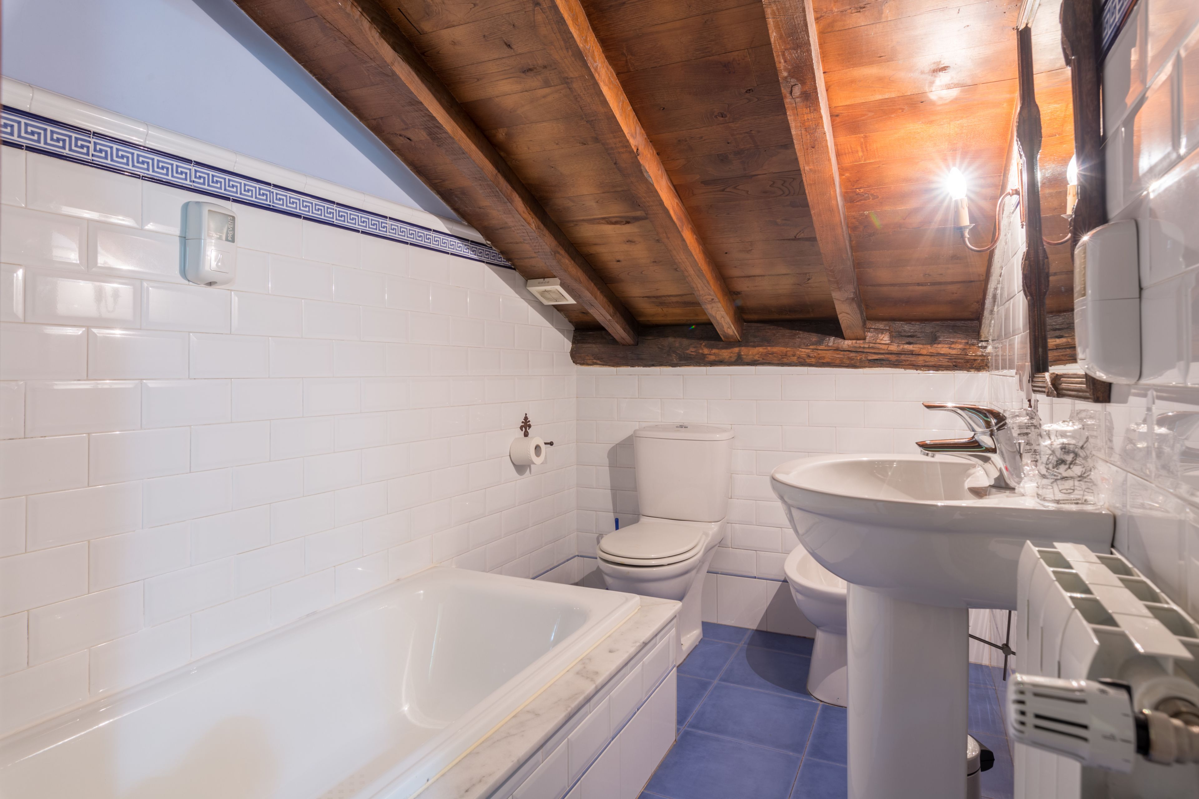 basic double room | bathroom | deep-soaking bathtub, rainfall showerhead, designer toiletries, towels