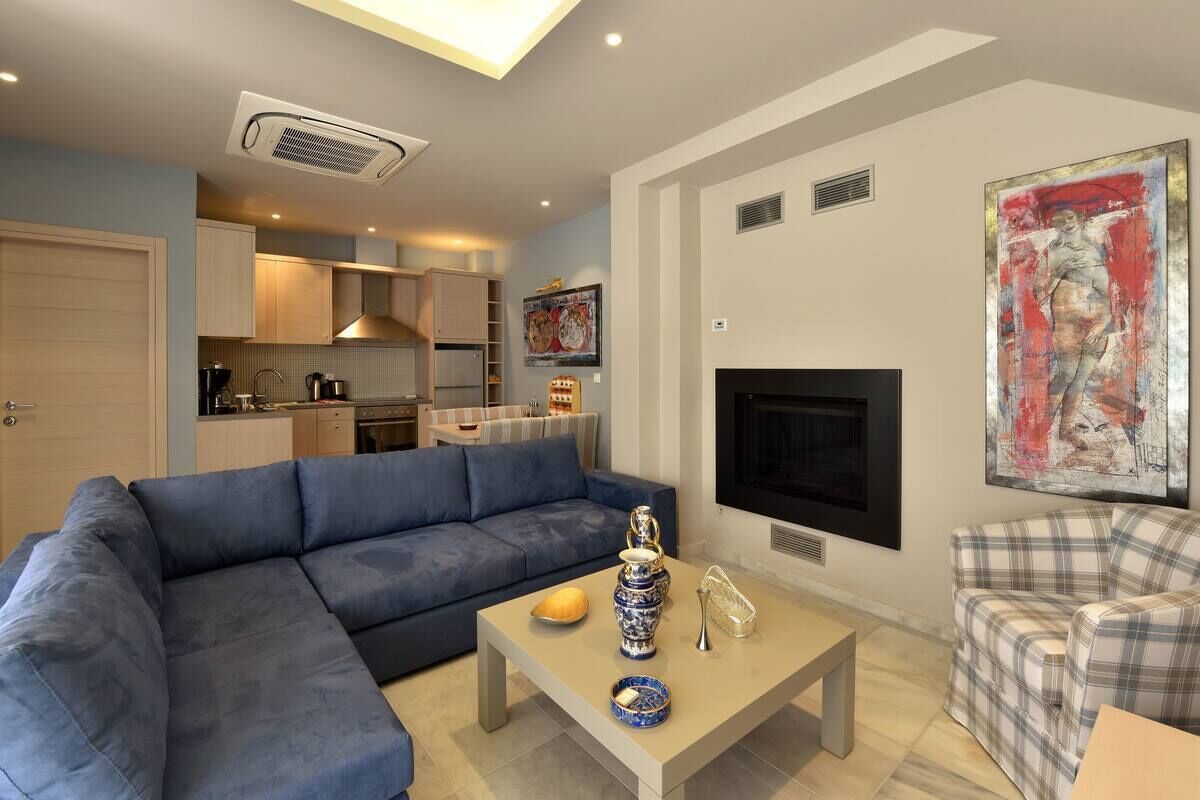 suite two bedroom split level with sharing pool and mountain view | living area | led tv