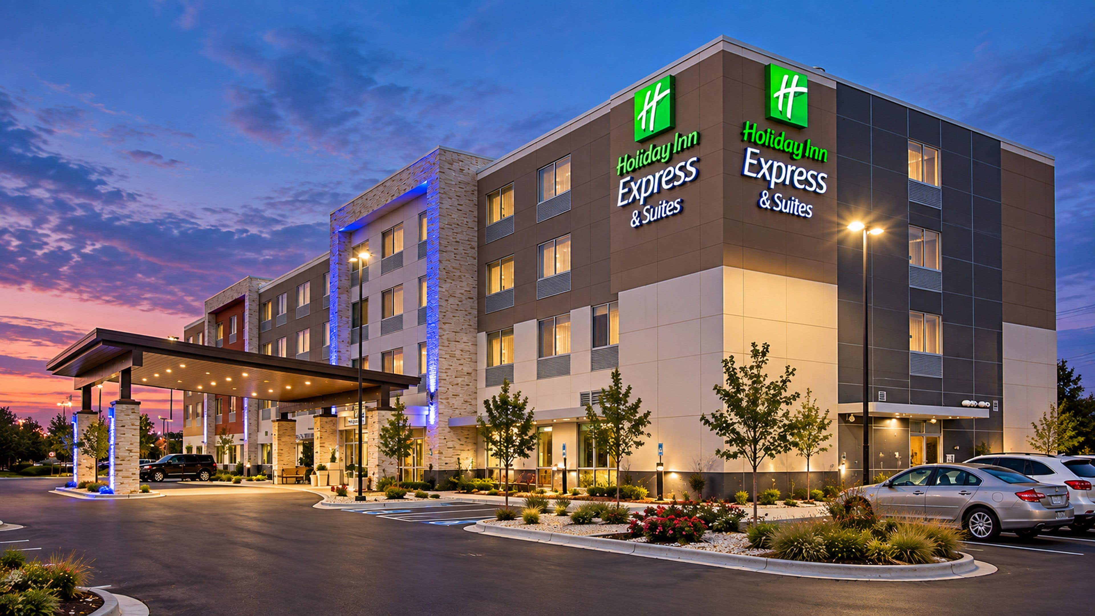 A Holiday Inn Express hotel with a modern design, multiple floors, and a covered entrance area.