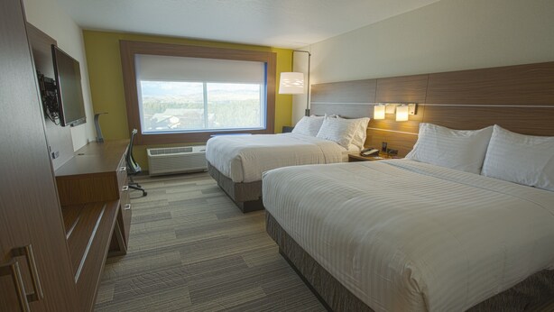 A hotel room with two beds, a desk, a chair, a TV, and a window with a view. - Holiday Inn Express & Suites Boise Airport by IHG (Boise)