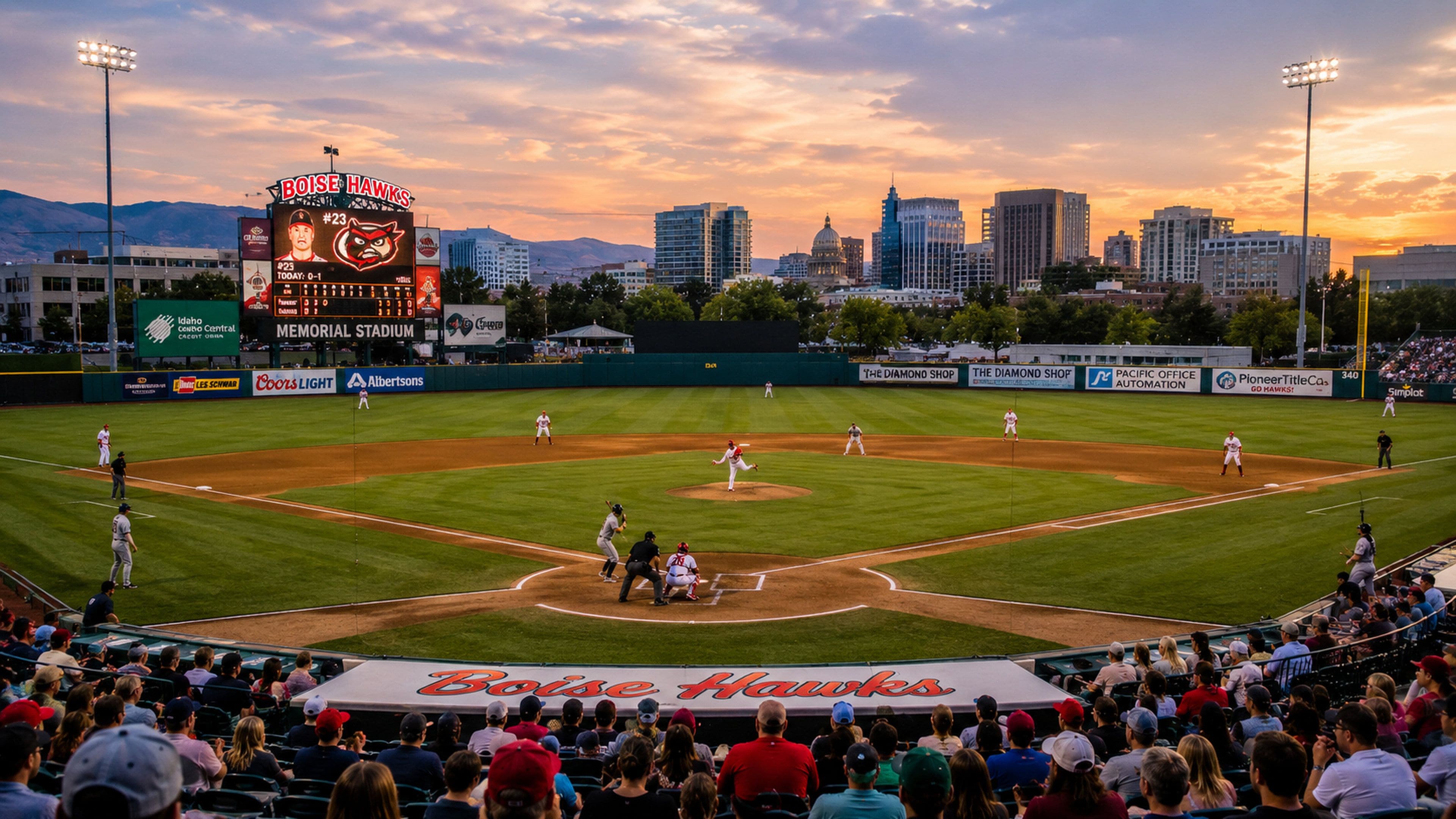 Un stade de baseball doté d’un grand tableau d’affichage, de gradins pour les spectateurs et, en arrière-plan, d’une vue sur les gratte-ciel de la ville.