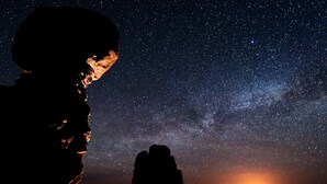 A silhouette of a person gazing at a starry night sky with a distant horizon. - Holiday Inn Express & Suites Boise Airport by IHG (Boise)