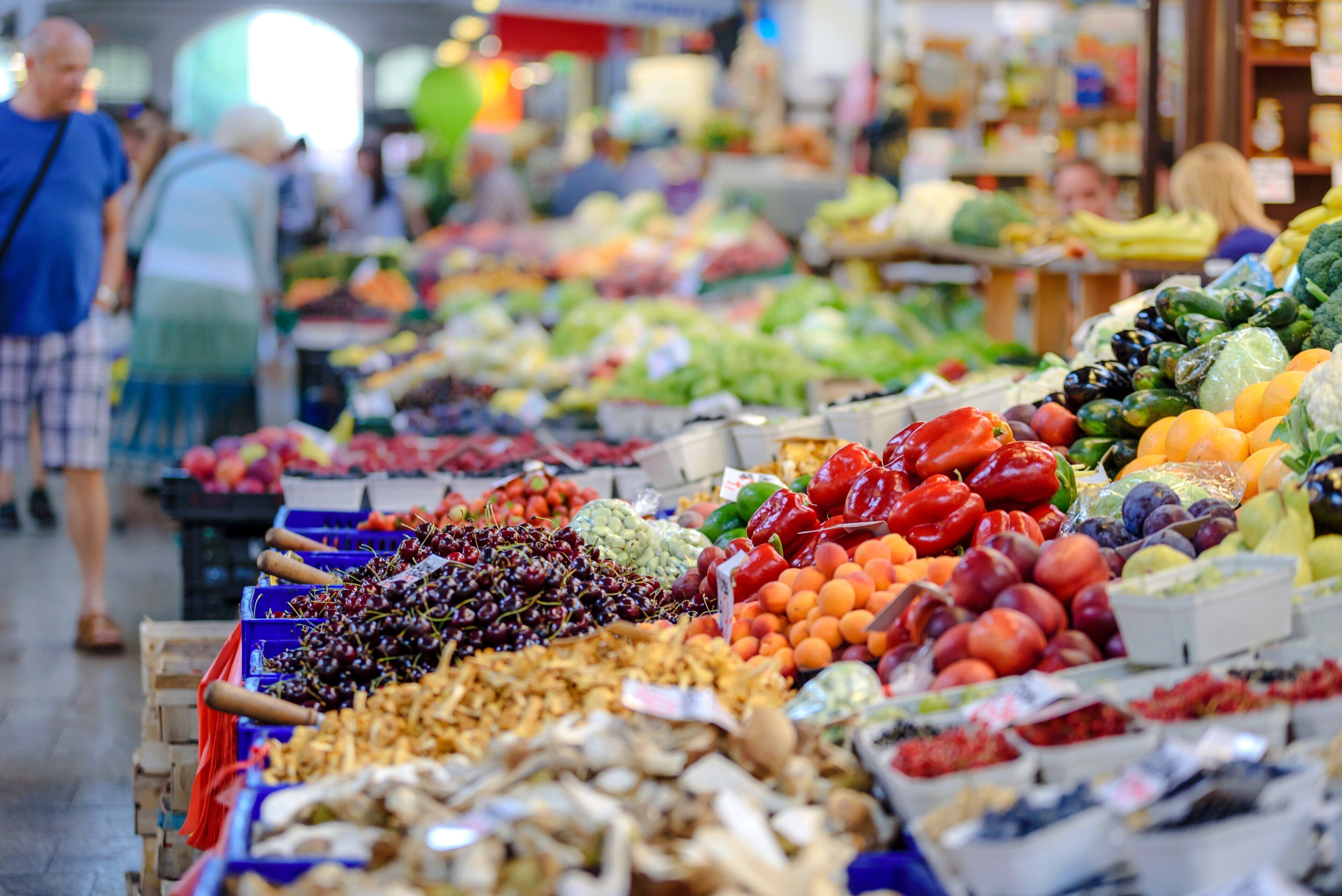 A market with various fruits and vegetables on display.