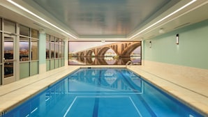 An indoor swimming pool with a mural of a bridge on the wall. - Hyatt Place Washington DC/Georgetown/West End (Washington)