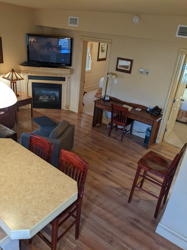Deluxe Suite, 2 Bedrooms, River View | Living area | 60-inch plasma TV with premium TV channels, TV, fireplace - Third Mission Heritage Suites (Peace River)