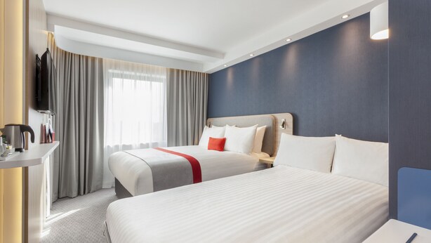 A hotel room with two beds, a desk, and a TV. - Holiday Inn Express St. Albans - M25, Jct.22 by IHG (St Albans)