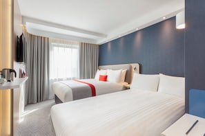 A hotel room with two beds, a TV, a desk, and a window with curtains. - Holiday Inn Express St. Albans - M25, Jct.22 by IHG (St Albans)