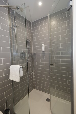 Shower, hydromassage showerhead, eco-friendly toiletries, hair dryer