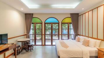 Deluxe Triple Room, 1 Bedroom, Balcony, Garden View | In-room safe, free WiFi, bed sheets