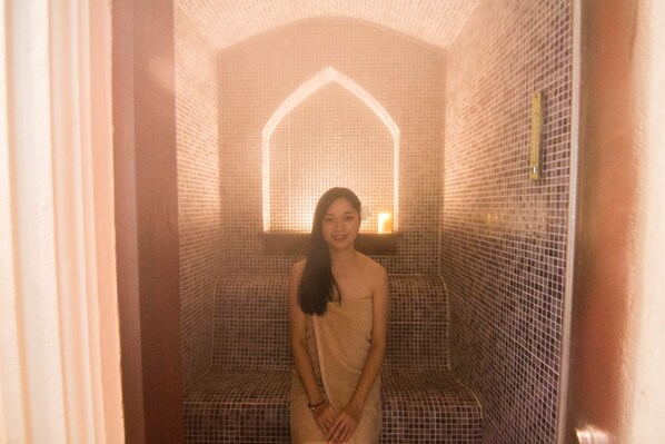 A person in a tiled room with a geometric wall design. - Fanli Resort Chiang Mai (Mae Rim)