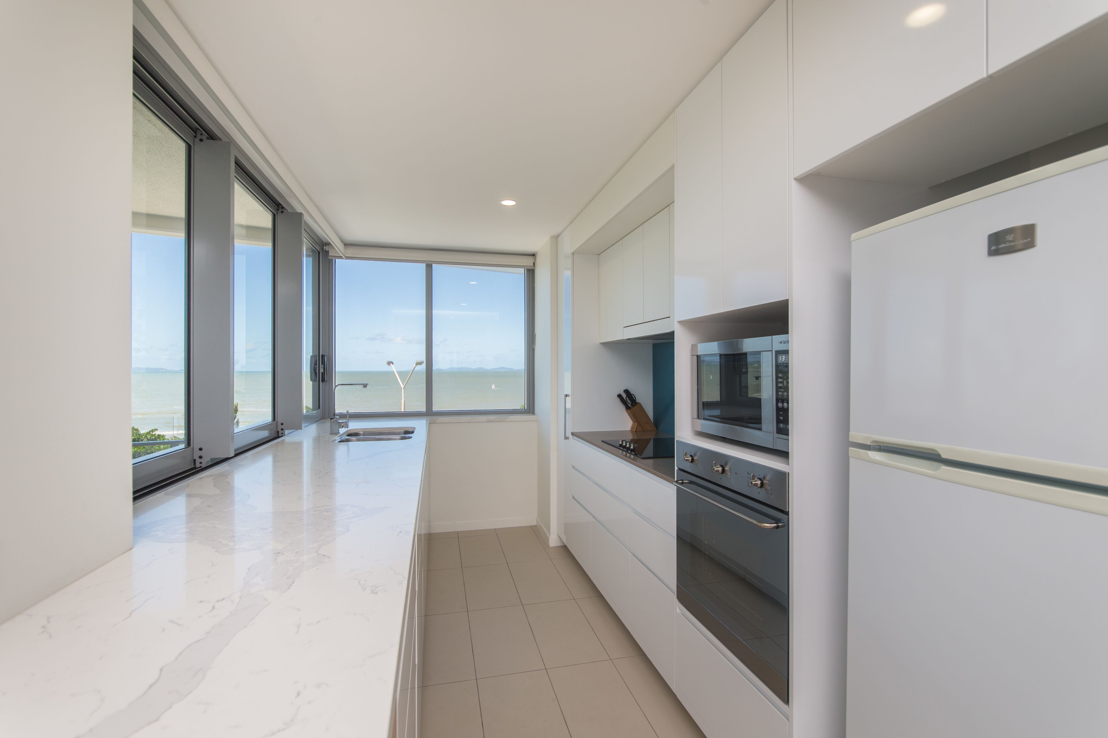 2 bedroom panoramic apartment | private kitchen | full-sized fridge, microwave, stovetop, dishwasher