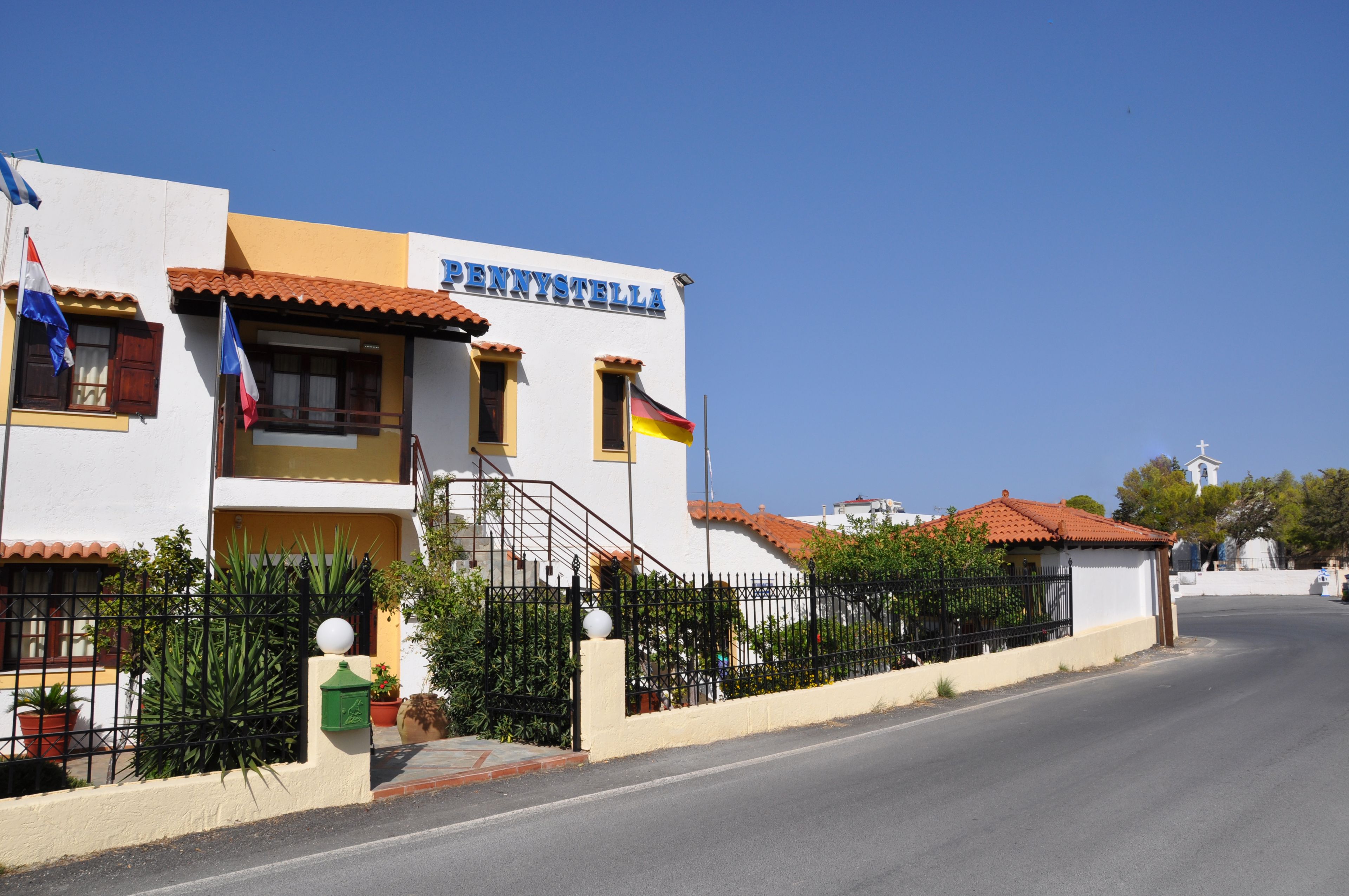 A two-story building with a sign reading "PENNYSTELLA".