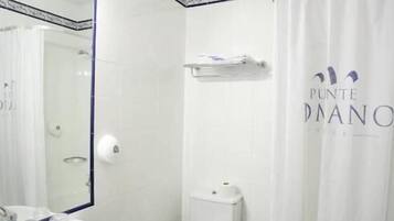 A bathroom with a white sink, toilet, and bathtub.