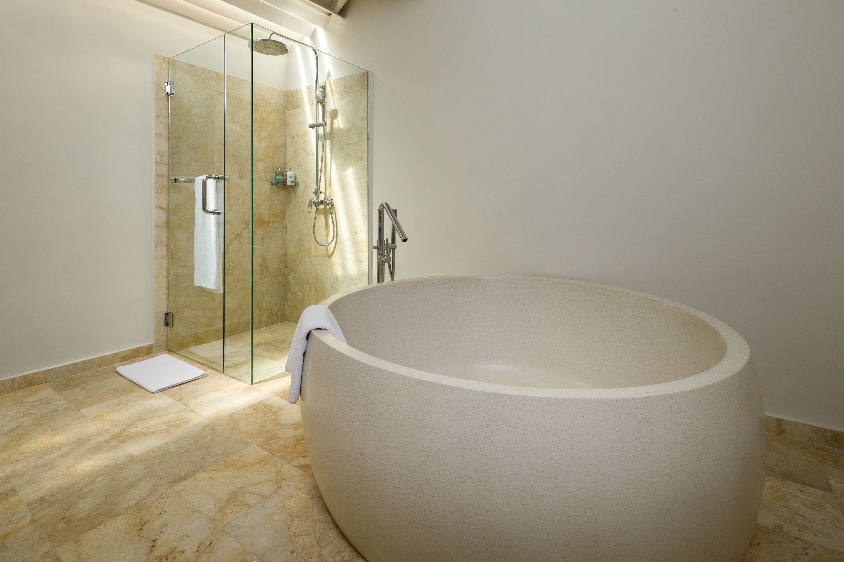 Separate bathtub and shower, deep-soaking bathtub, designer toiletries