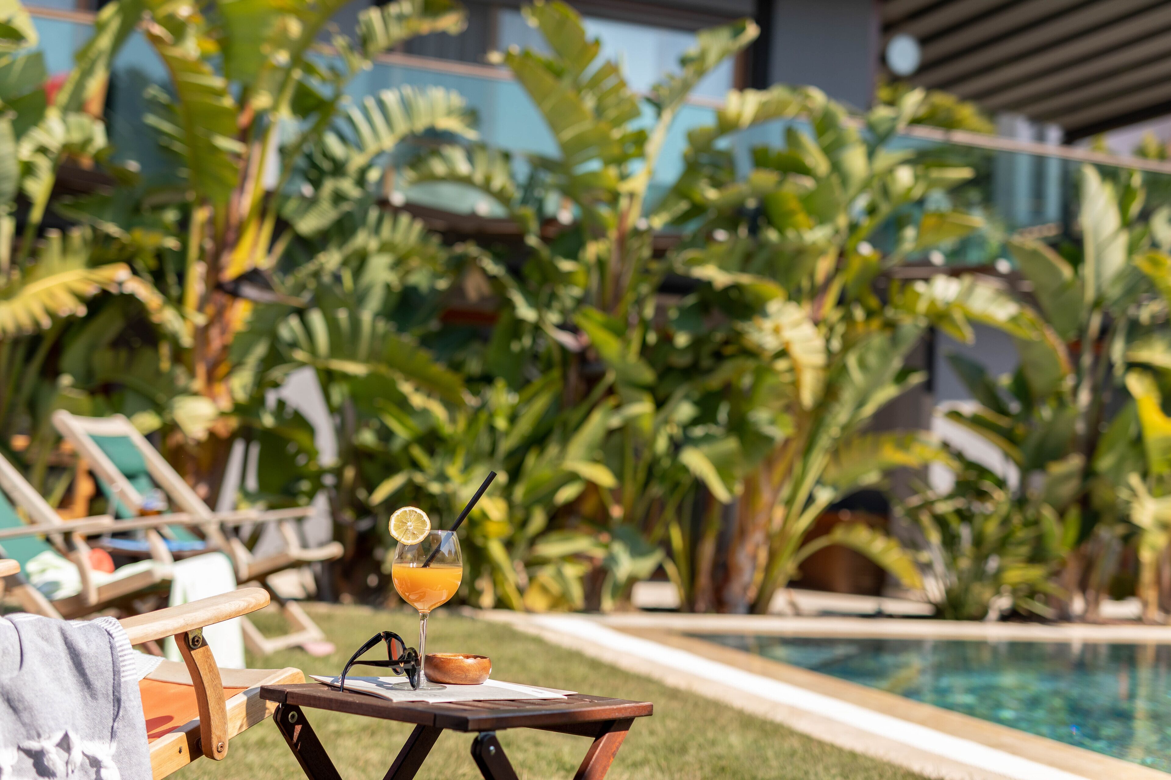 outdoor pool, pool umbrellas, pool loungers