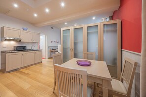 Traditional Studio (Grecale) | Living area | Flat-screen TV